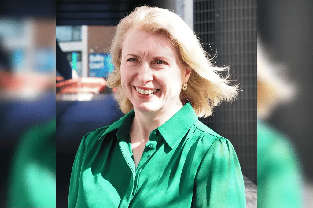 Bridget Edminson, Scar Free Foundation team member, wearing a green shirt and smiling outdoors.