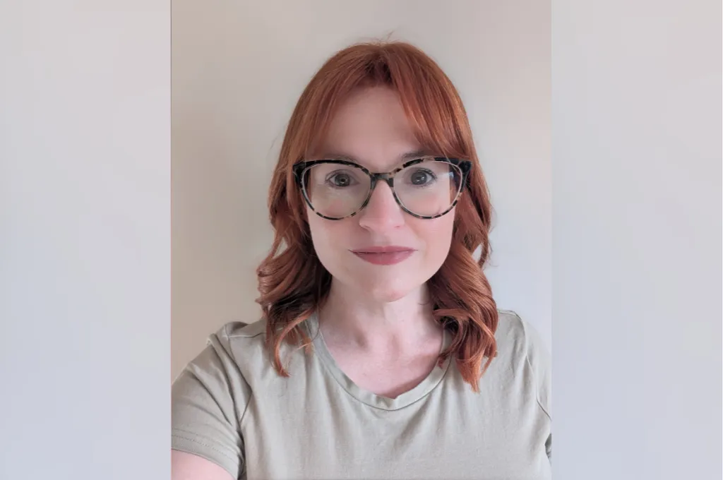 Jill McCoy, team member at Scar Free Foundation, wearing glasses and a light green shirt against a neutral background.
