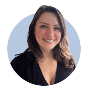 Anca Bratu wears a black top and smiles directly at the camera in this headshot-style picture.